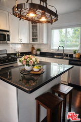 7013 Andasol Ave - Photo 2 of 8