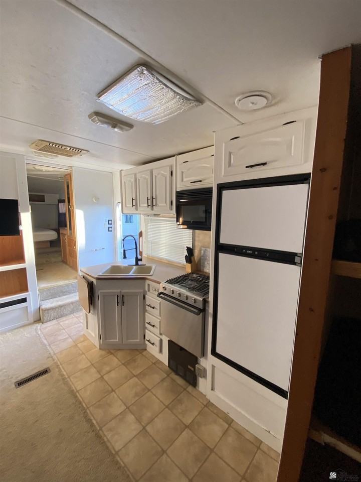 12617 E 46th Dr E 46 DR #1 - Photo 3 of 22