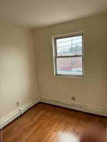 11651 Farmers Blvd Apt 2 - Photo 3 of 5