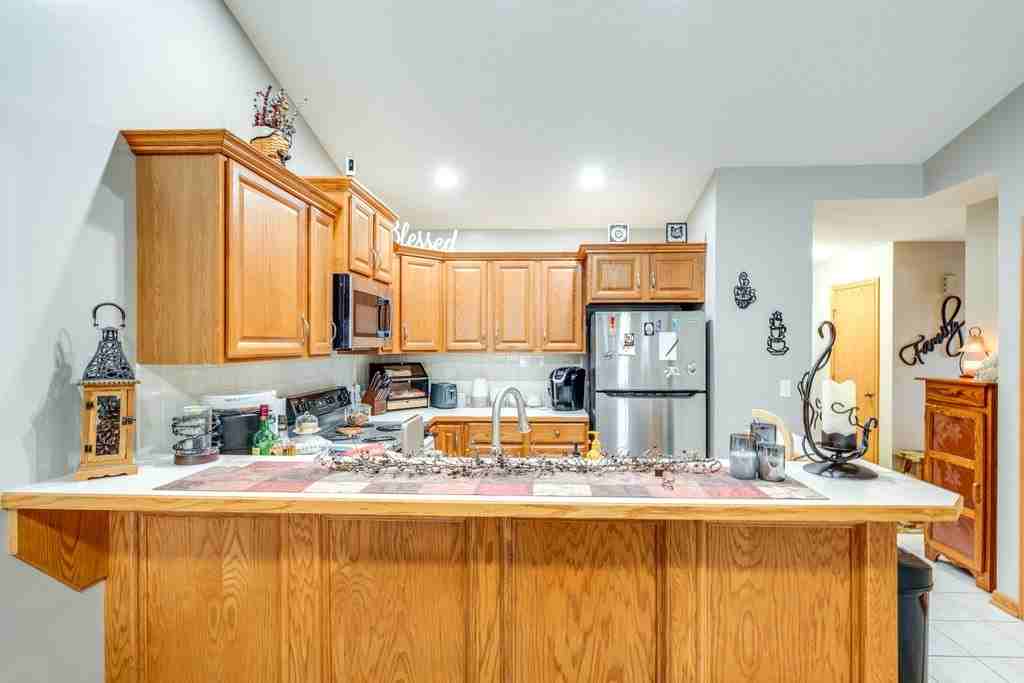 10393 Scotney Ave Nw #LEFT - Photo 7 of 24