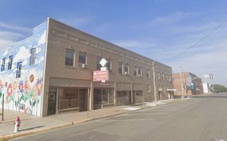 featured image of 107 E 6th St