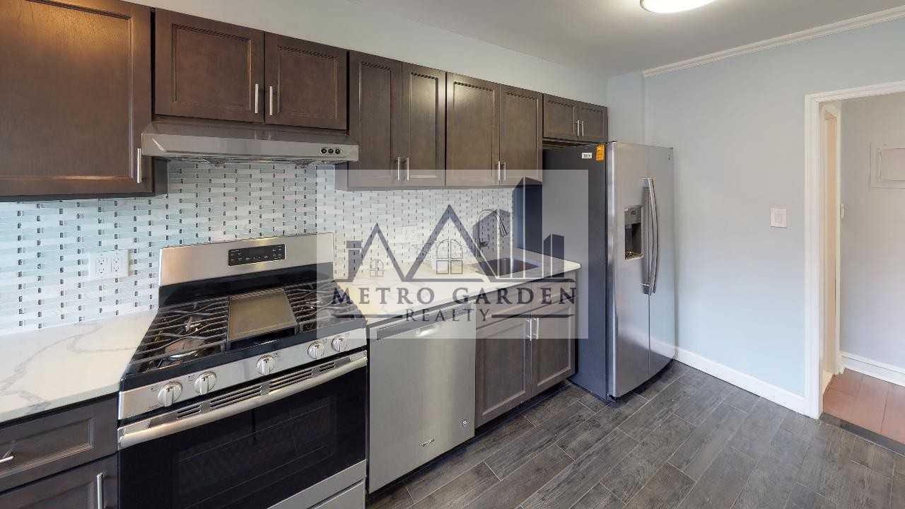 67-12 Juno Street - Photo 4 of 31