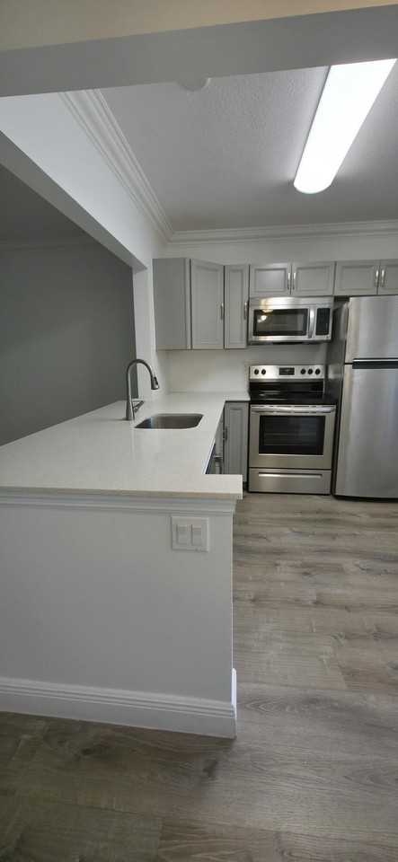 6091 Nw 61st Ave #105 - Photo 2 of 26