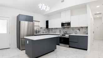 3BR Apartment w/ High Ceilings, Upgraded Appliances & Large Yard - Photo 1 of 1