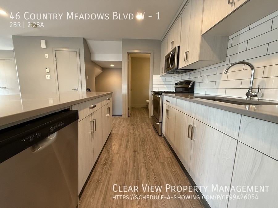 46 Country Meadows Blvd W #1 - Photo 5 of 22