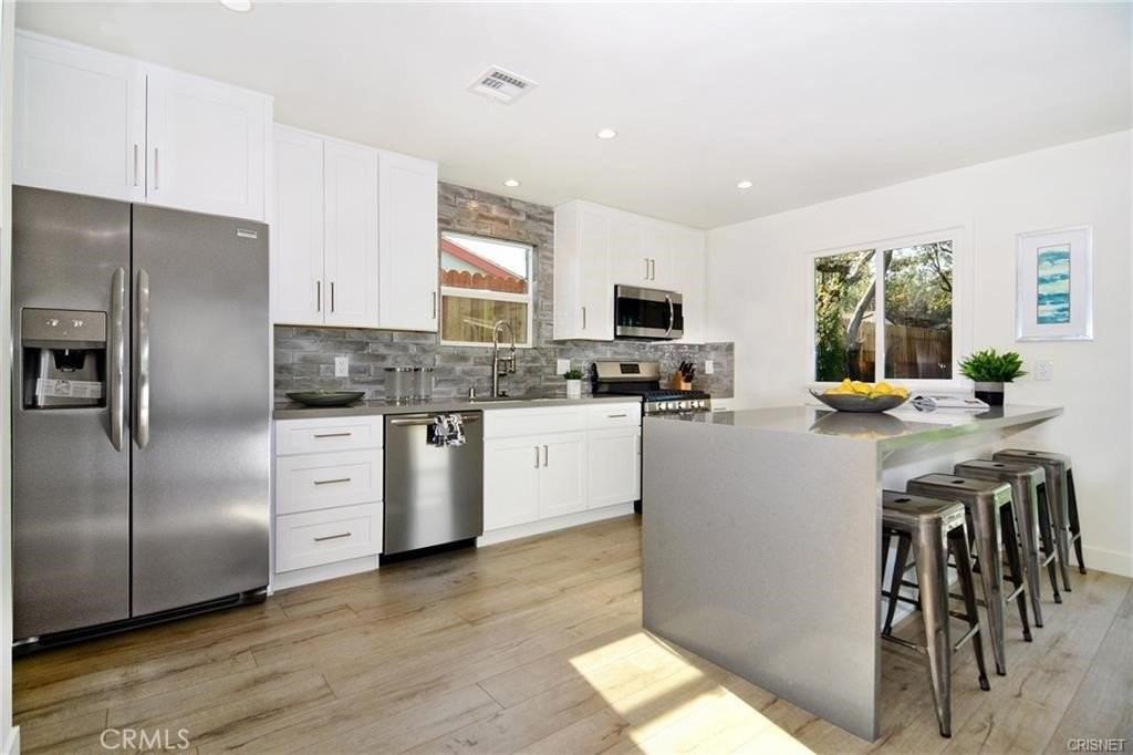 7509 Kentland Ave - Photo 4 of 16