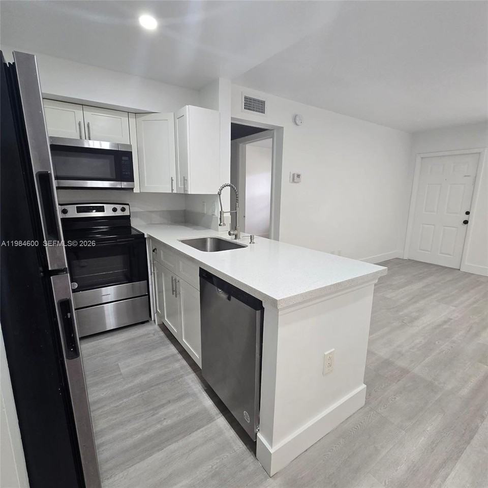 10020 Winding Lake Rd #104 - Photo 6 of 21