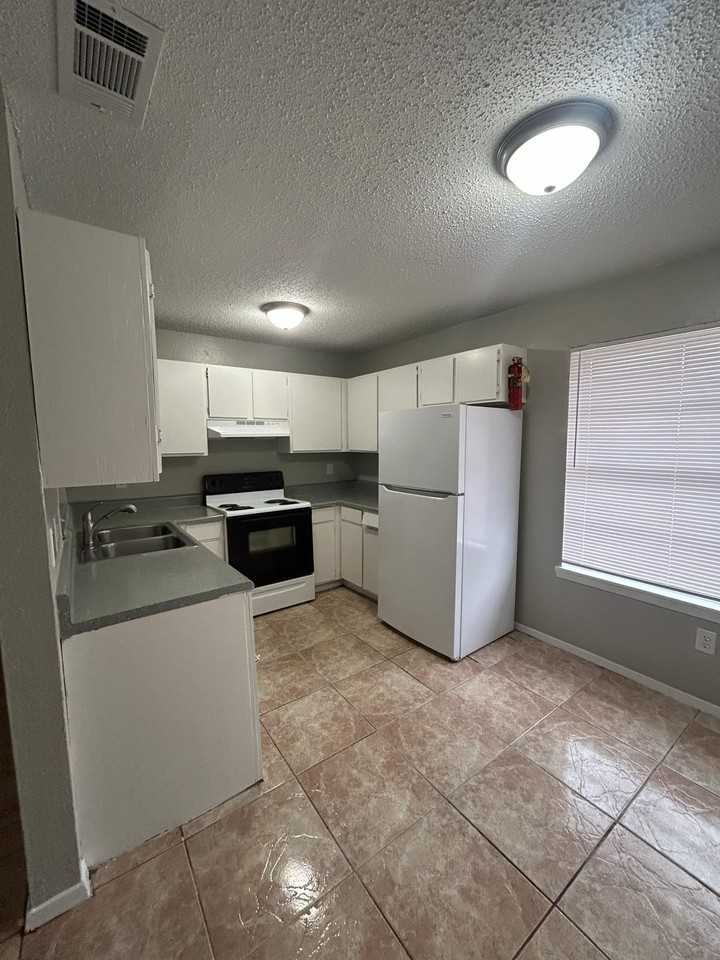 Village Apartments - Photo 2 of 5