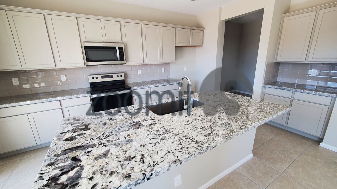 2027 E Wetleaf Pl - Photo 5 of 33