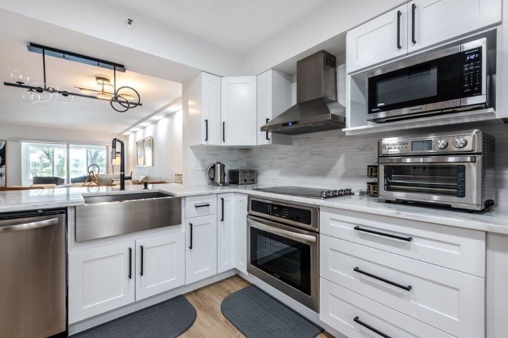 6096 Huntwick Ter #303 - Photo 4 of 48