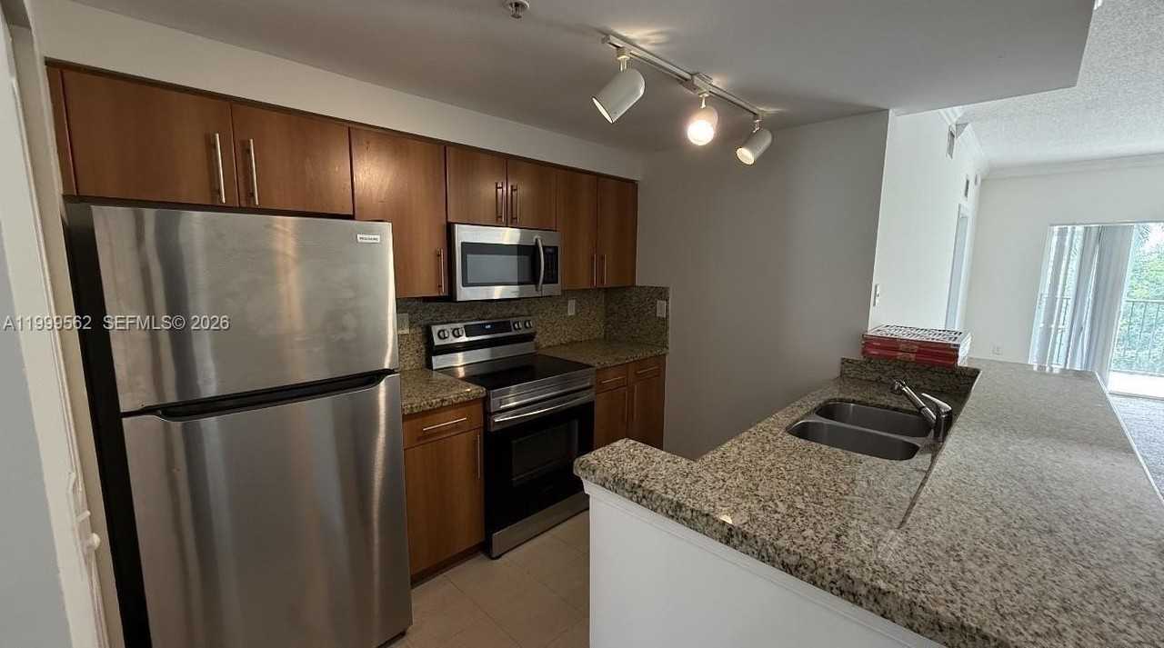 5800 W Sample Rd #307 - Photo 2 of 5