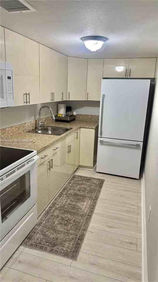 8794 Sw 12th St #103 - Photo 2 of 8