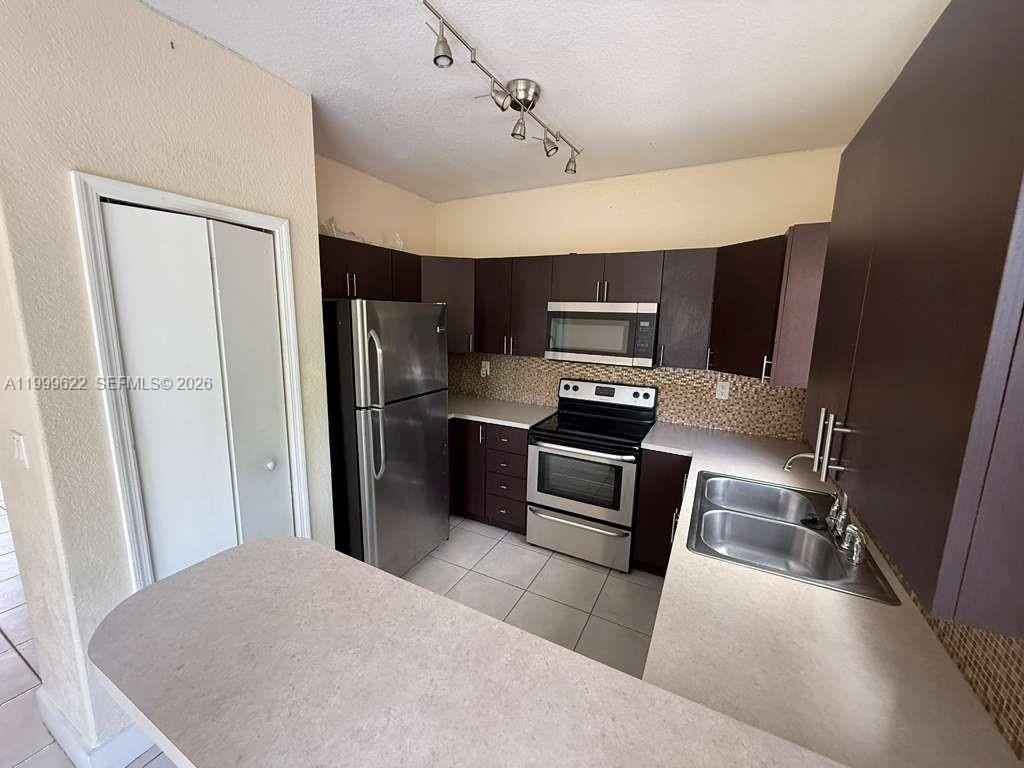 6990 Nw 177th St #J100 - Photo 2 of 21