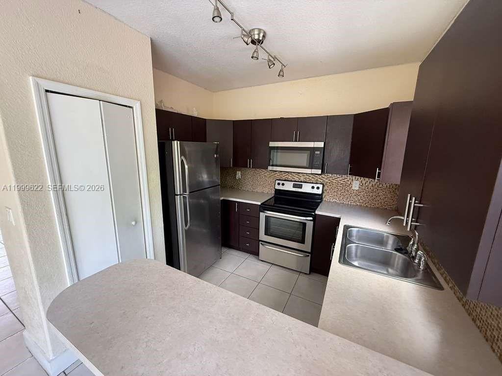 6990 Nw 177th St #J100 - Photo 4 of 21