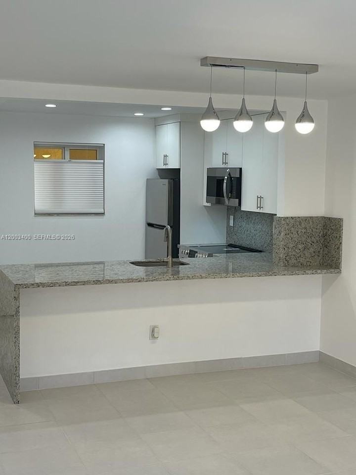 7732 Camino Real #F318 - Photo 2 of 18