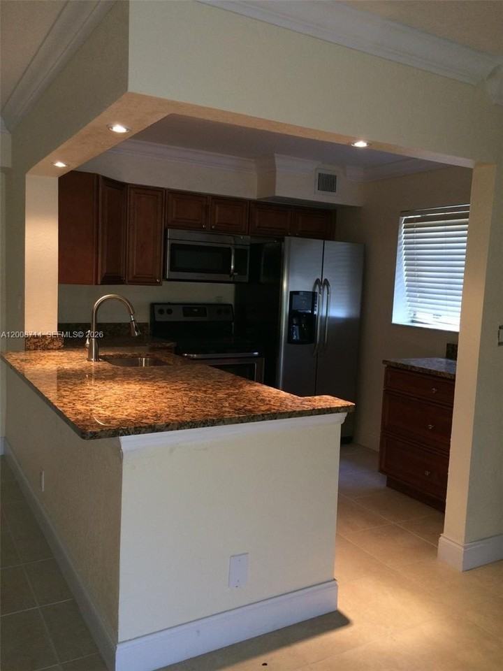 407 Gardens Dr #103 - Photo 2 of 9