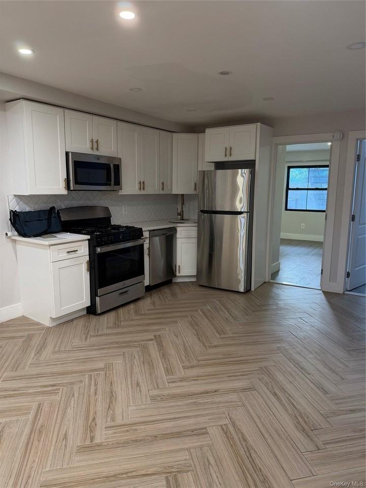 11342 Springfield Blvd #1stFL - Photo 2 of 5