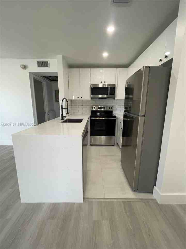 10016 Winding Lake Rd #202 - Photo 6 of 16