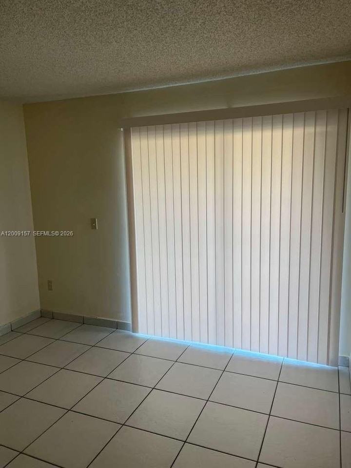 9712 Hammocks Blvd #202-30 - Photo 2 of 8