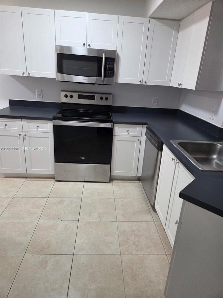 8871 Wiles Rd #208 - Photo 2 of 16