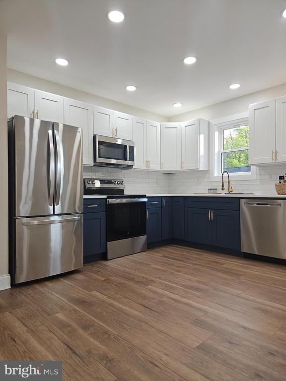 115 E 2nd St - Photo 2 of 32