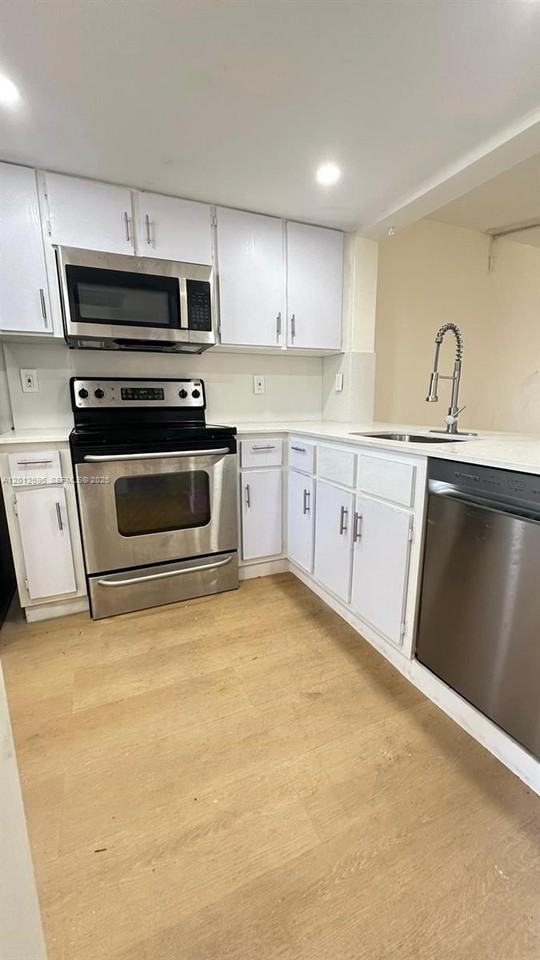 901 Ne 209th Ter #104-26 - Photo 3 of 22