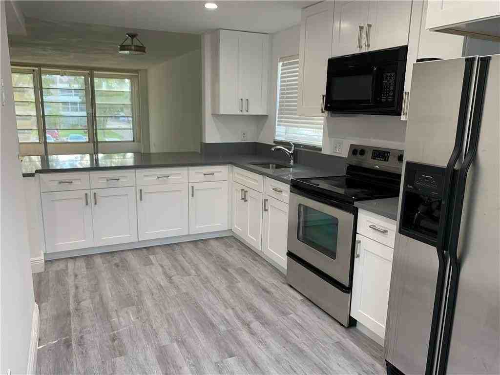 8390 Sands Point Blvd #210F - Photo 3 of 9