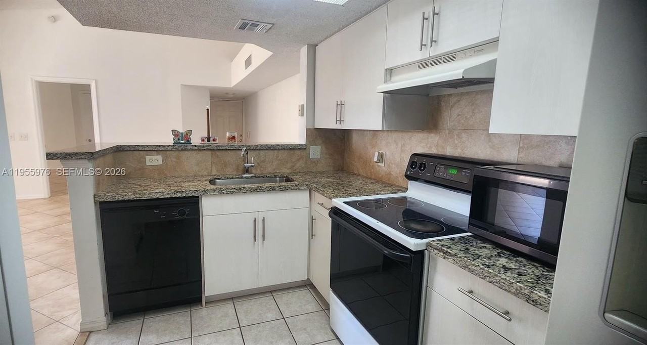 5011 Wiles Rd #306 - Photo 6 of 17