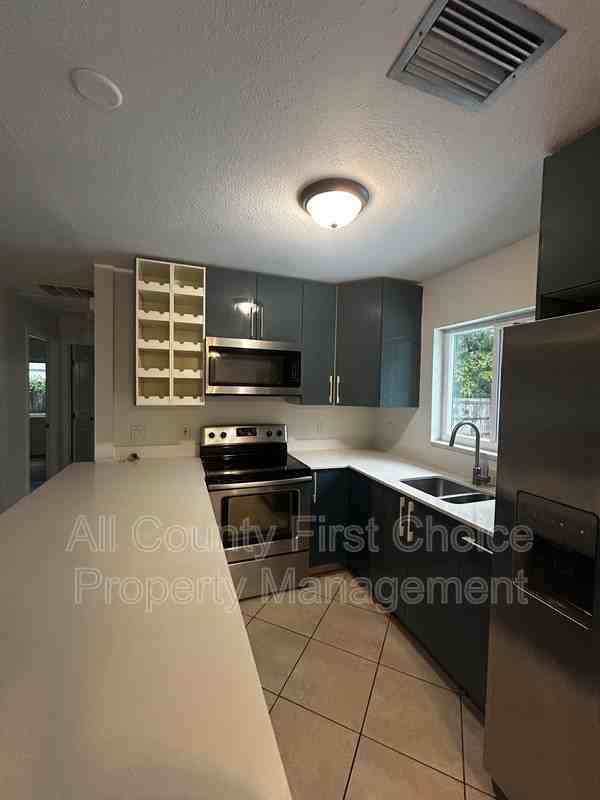 9369 93rd Ave - Photo 2 of 23