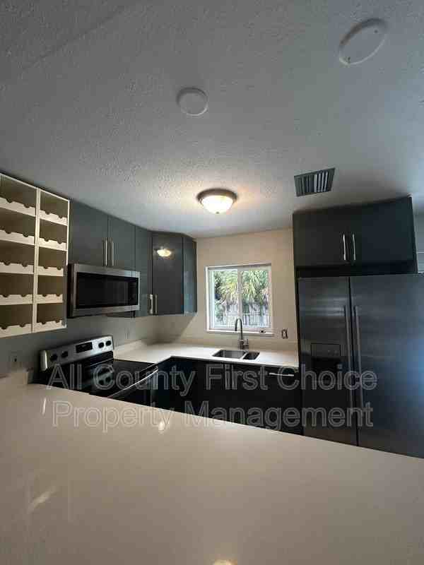 9369 93rd Ave - Photo 4 of 23
