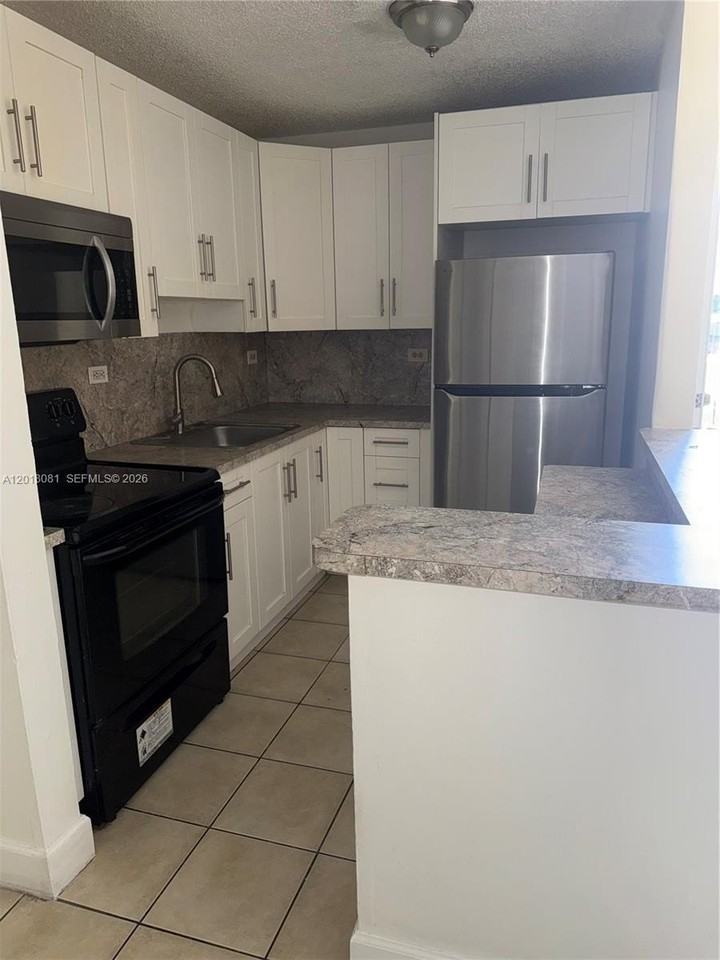 7120 Nw 179th St #105 - Photo 2 of 6