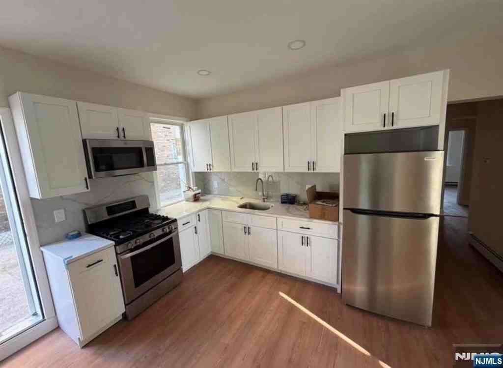 66 Harrison Ave - Photo 2 of 11