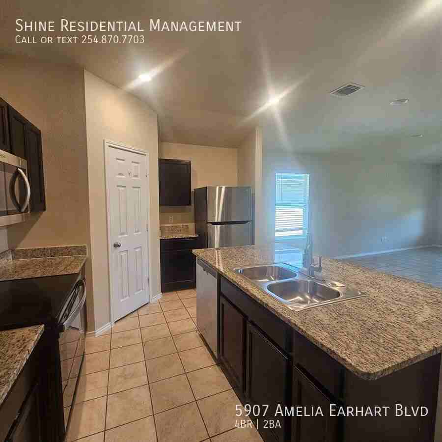 5907 Amelia Earhart Blvd - Photo 4 of 9
