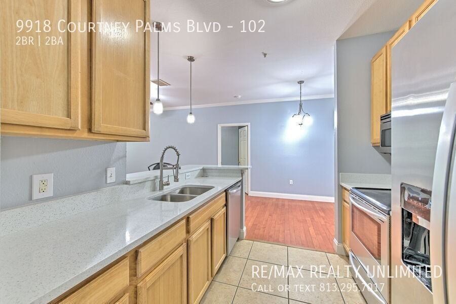 9918 Courtney Palms Blvd #102 - Photo 6 of 34