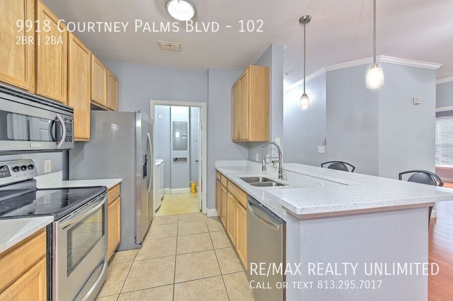 9918 Courtney Palms Blvd #102 - Photo 7 of 34
