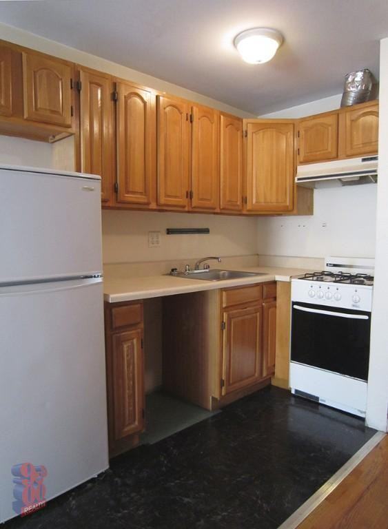 411 E 12th St - Photo 2 of 5