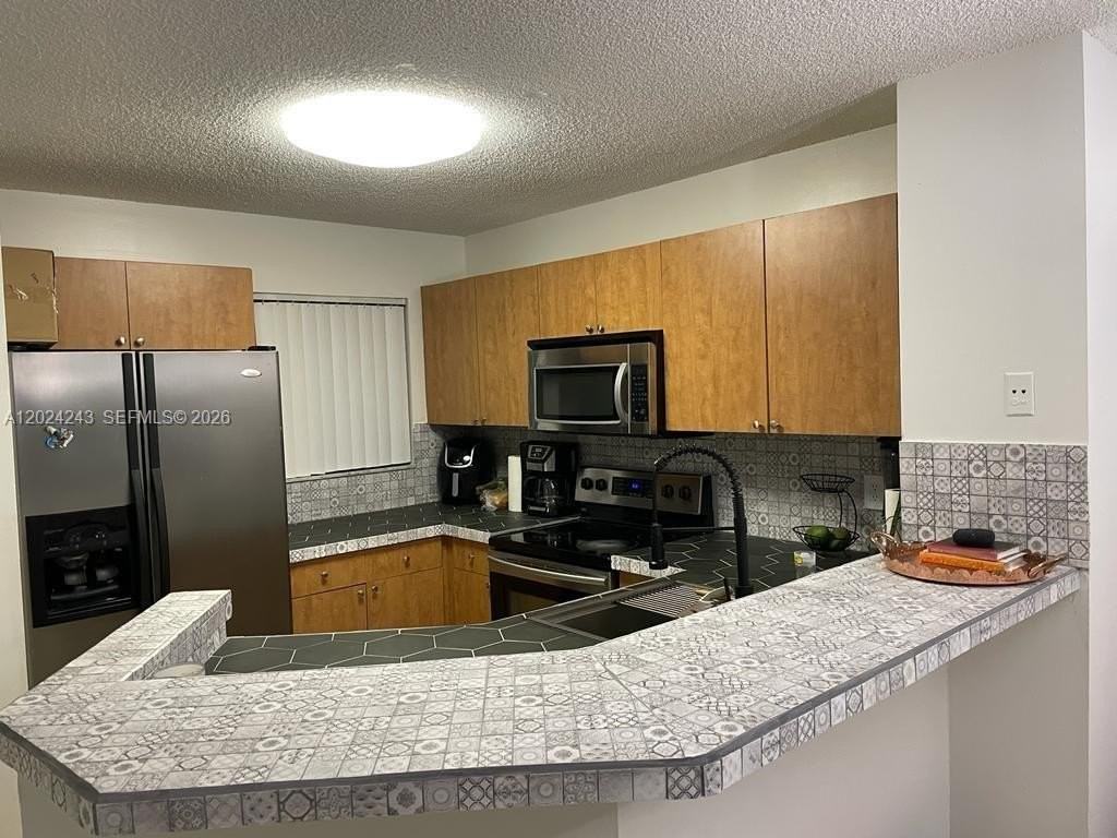 8750 N Sherman Cir #208