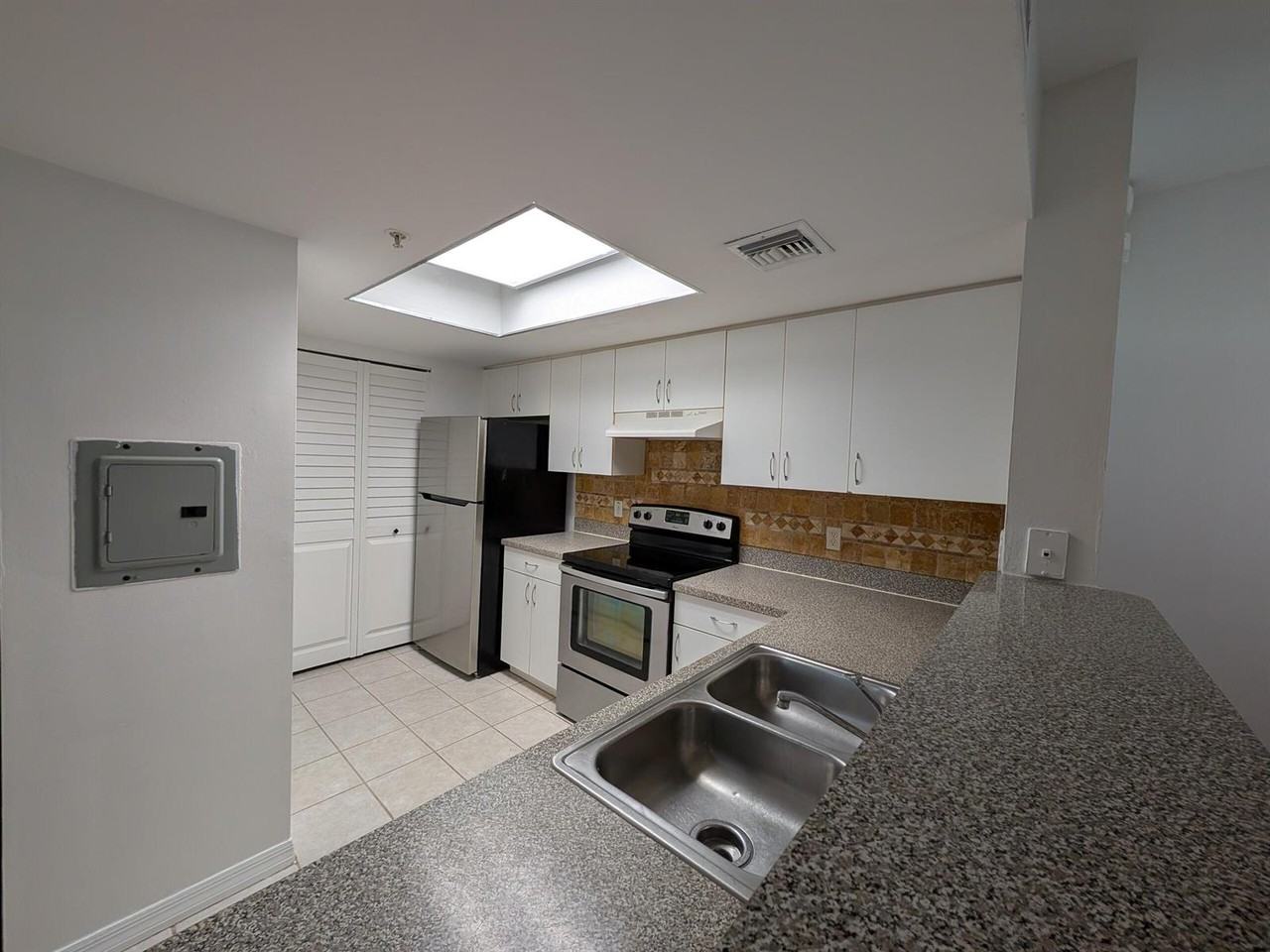 5001 Wiles Road #105 - Photo 2 of 5