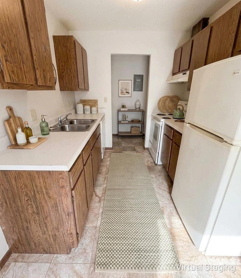 Village Green Apartments - Holloway - Photo 2 of 13