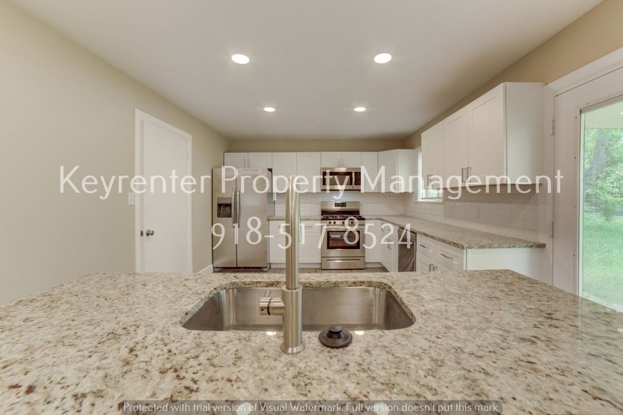 11621 N 103rd East Ave - Photo 4 of 35