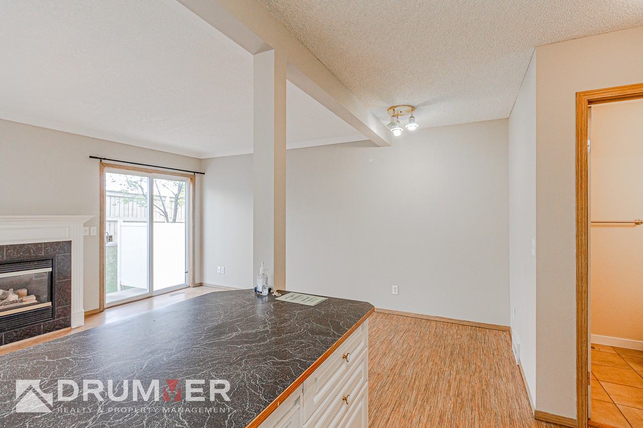 Stunning 2 Bedroom + Den Townhouse w/ Single Car Garage in Country Hills! - Photo 6 of 20