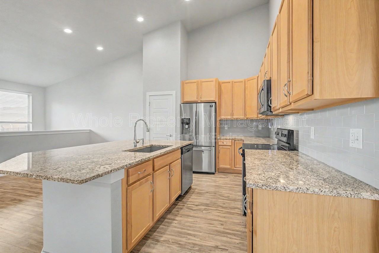 9985 E 59th Ave - Photo 6 of 31