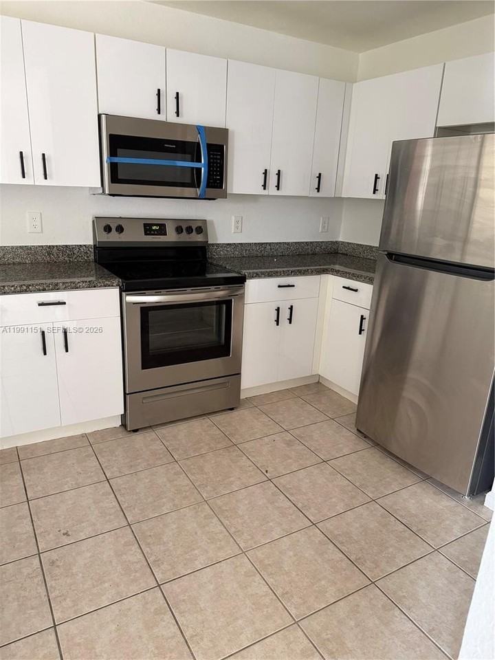 11001 Nw 83rd St #103 - Photo 6 of 12