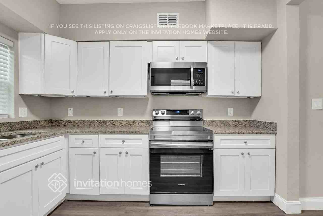 6825 Ambassador Dr - Photo 5 of 20