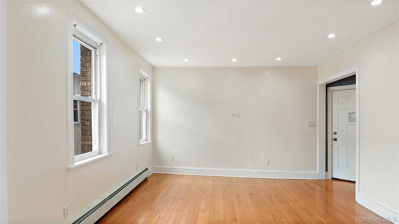 1129 E 221st St - Photo 6 of 16