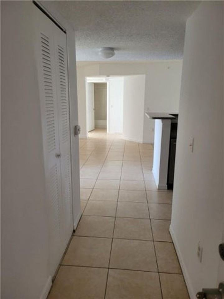 5005 Wiles Rd - Photo 3 of 12
