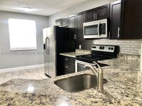 8761 Wiles Rd #306 - Photo 1 of 1