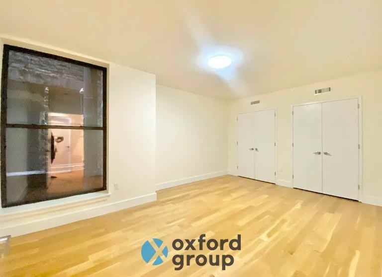 215 E 12th St - Photo 2 of 6