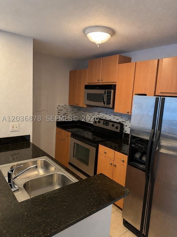 1825 Palm Cove Blvd #7-204 - Photo 3 of 21