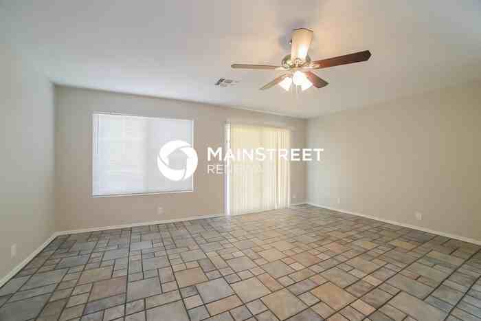 8645 W Mauro Ln - Photo 4 of 17